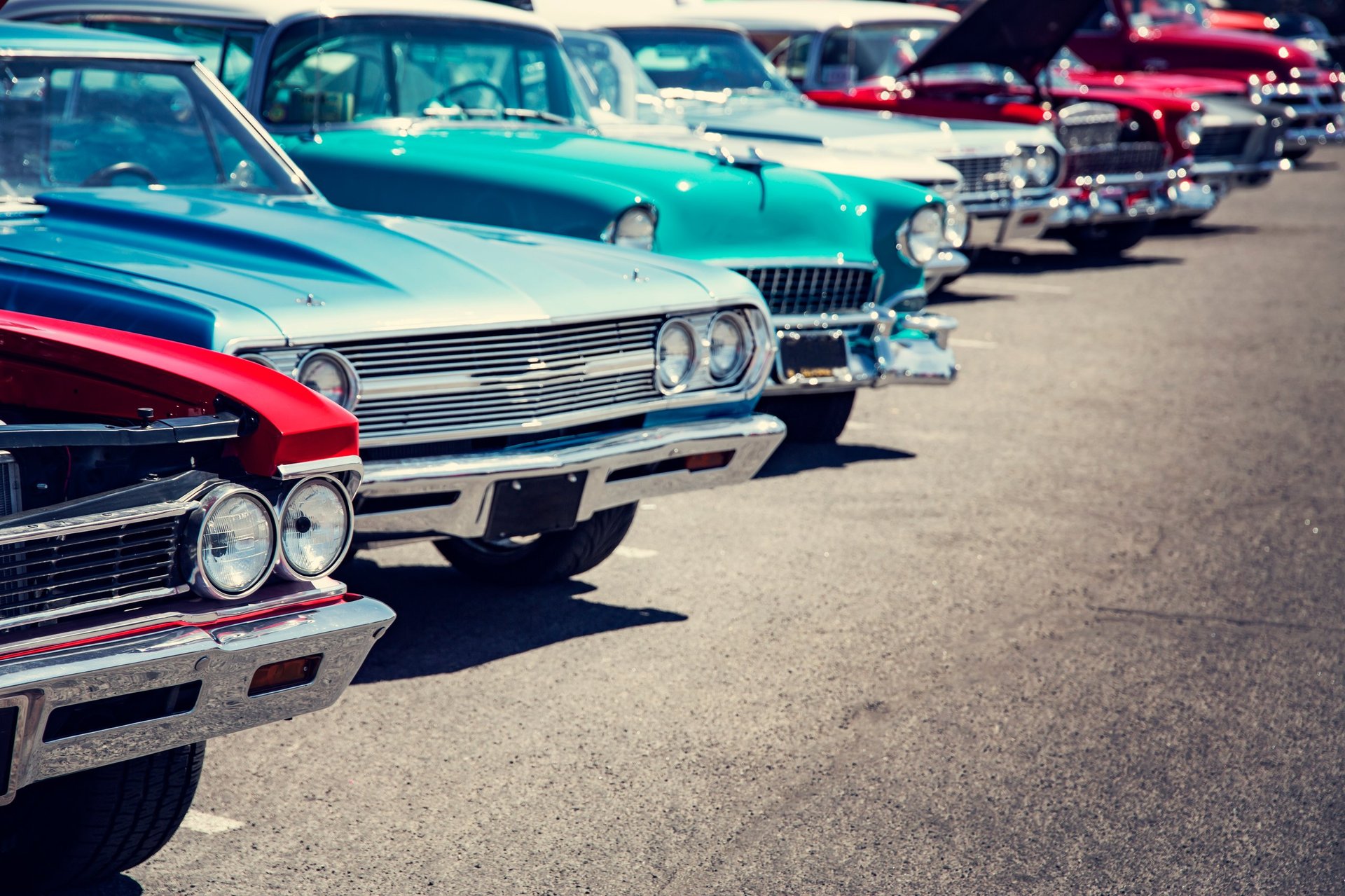 Vintage cars in a row at a car show