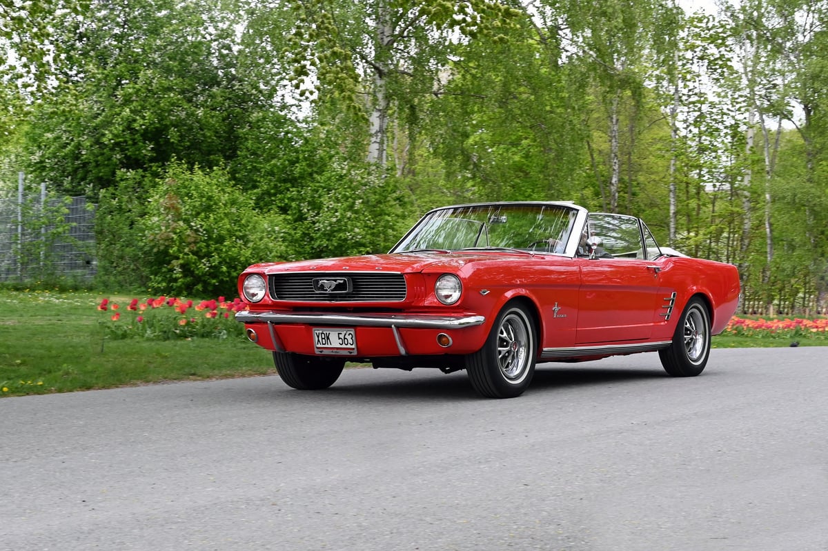 Classic Mustang convertible on country road