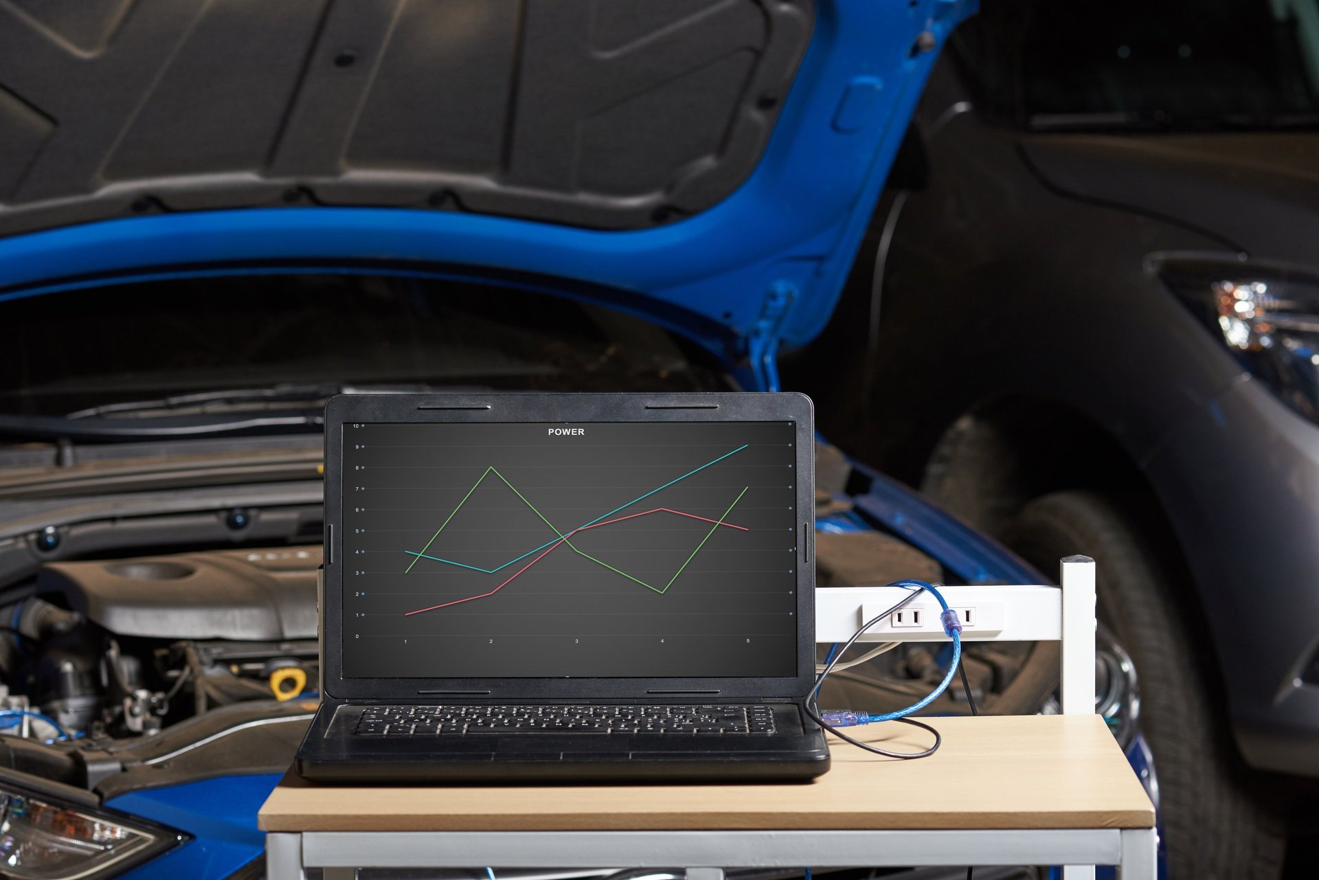 Car engine tuning and diagnostics with laptop
