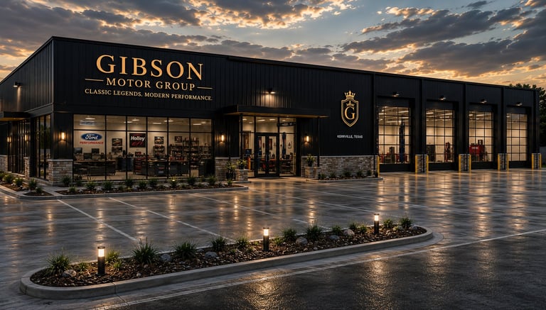 Gibson Motor Group luxury car dealership storefront at dusk with illuminated facade and wet pavement reflecting golden sky